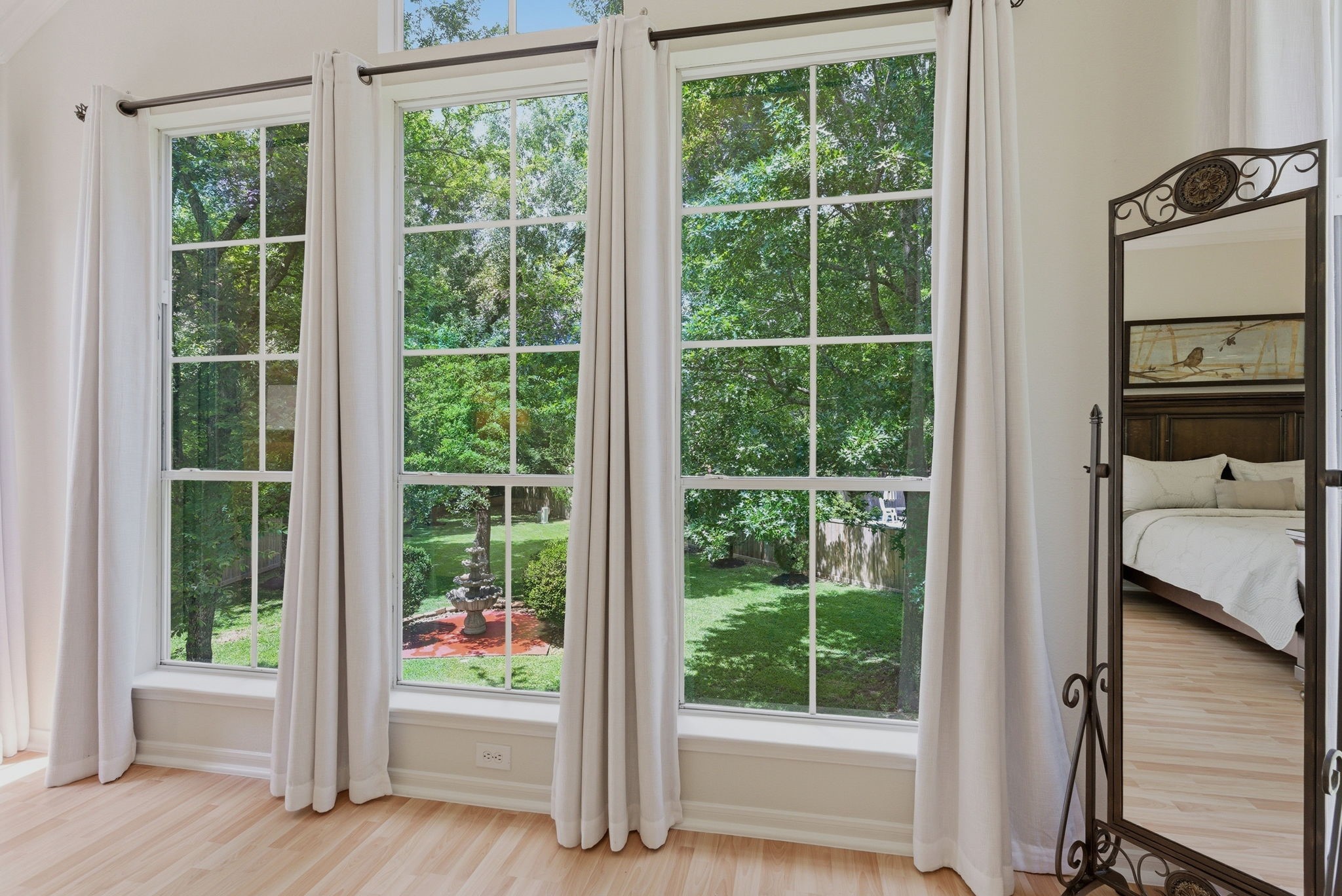 11 Dovewing Place Spring, TX 77382 - Photo 12 of 32 Light wooden floors and airy curtains enhance the spacious feel.