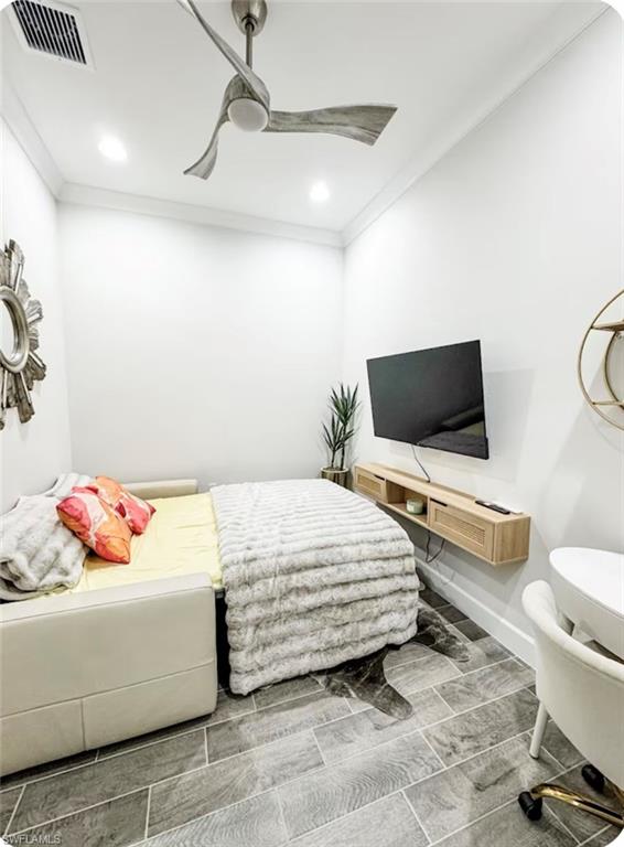 7289 Saona Court Naples, FL 34113 - Photo 11 of 17 a bedroom with a bed and flat screen tv
