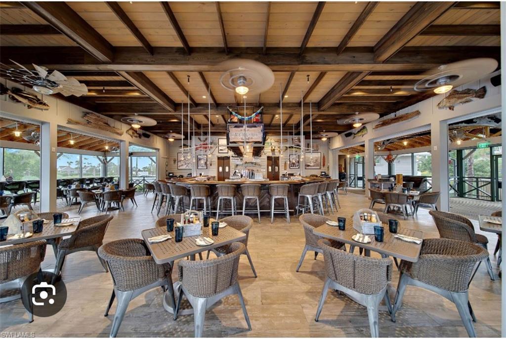 7289 Saona Court Naples, FL 34113 - Photo 17 of 17 a view of a bar restaurant
