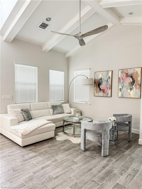 7289 Saona Court Naples, FL 34113 - Photo 3 of 17 a living room with furniture and a wooden floor