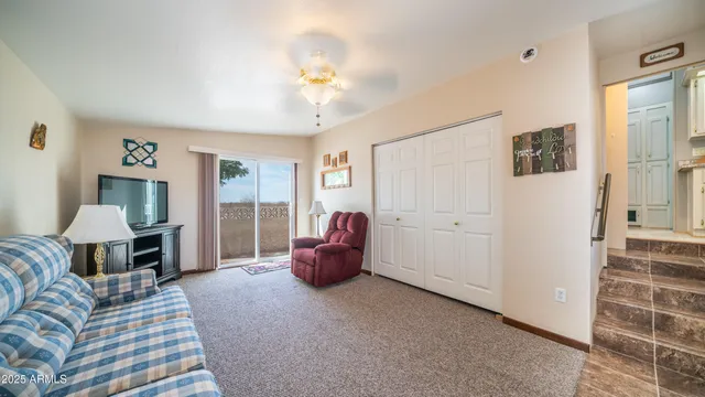 a bedroom with furniture and a window
