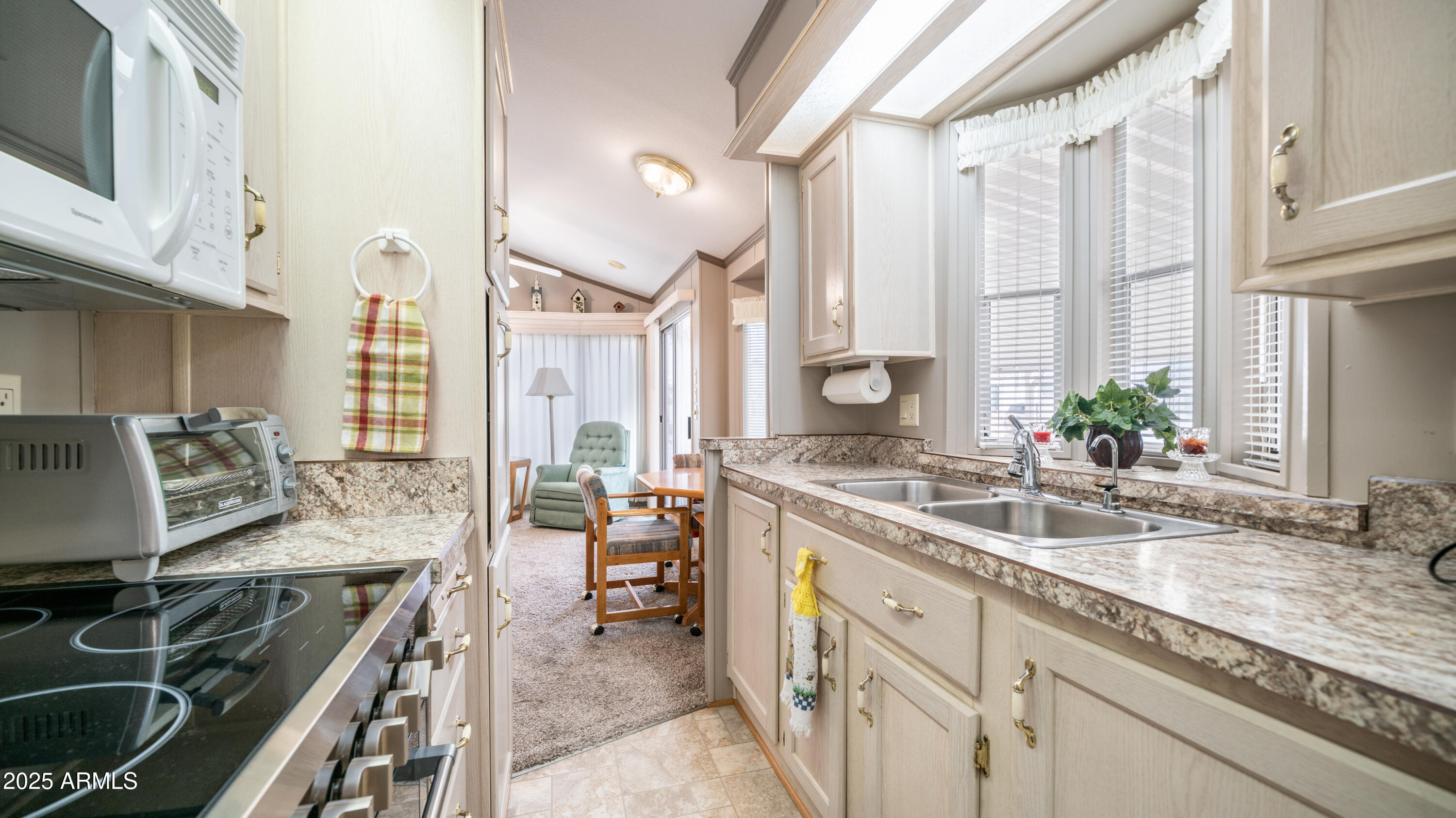3 Ore Cart Drive, Unit 3 Apache Junction, AZ 85119 - Photo 14 of 59 a kitchen with a sink stove and cabinets