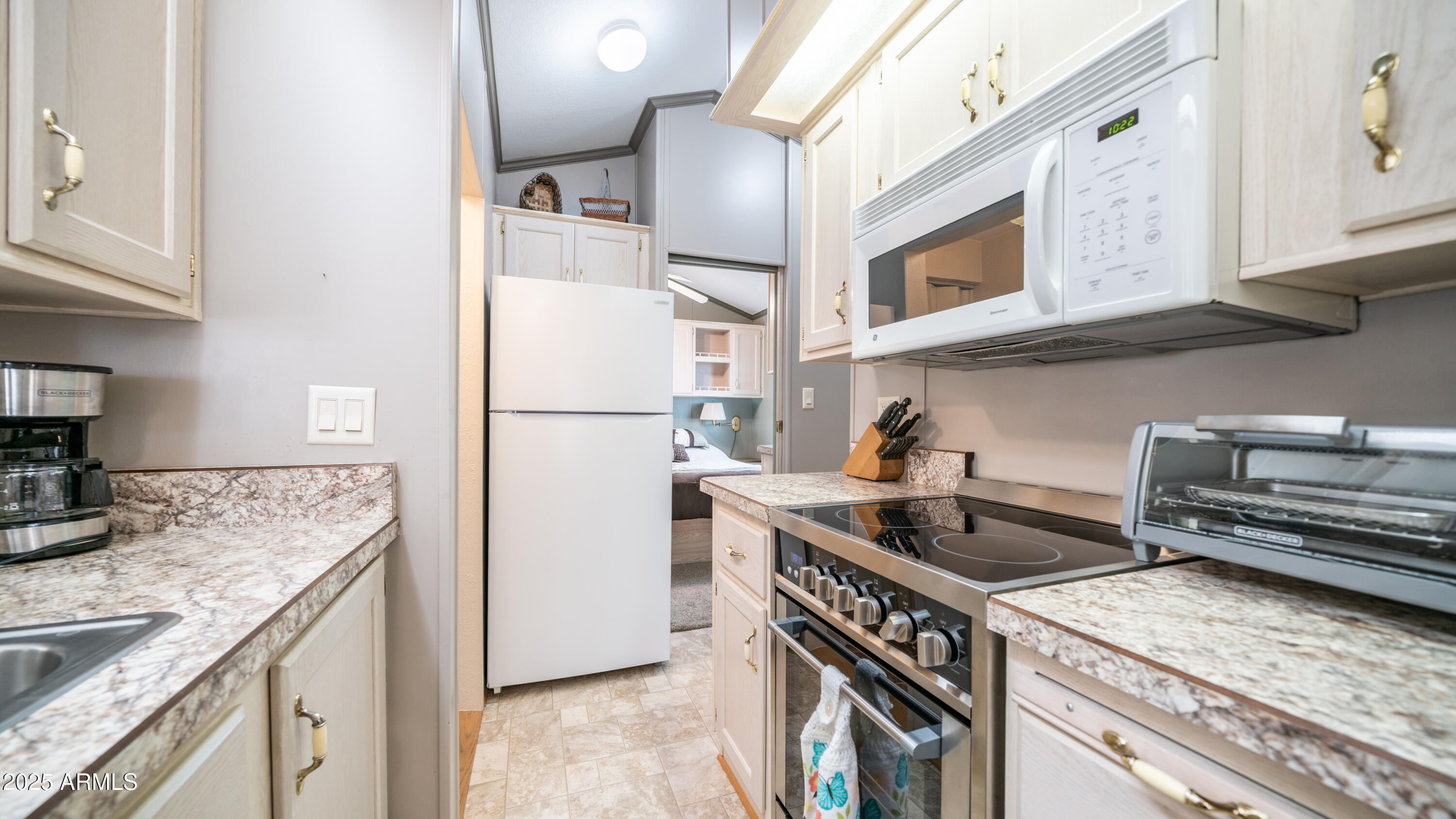 3 Ore Cart Drive, Unit 3 Apache Junction, AZ 85119 - Photo 15 of 59 a kitchen with stainless steel appliances granite countertop a sink stove and refrigerator