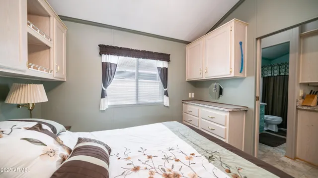 a bathroom with a granite countertop shower a mirror and a sink