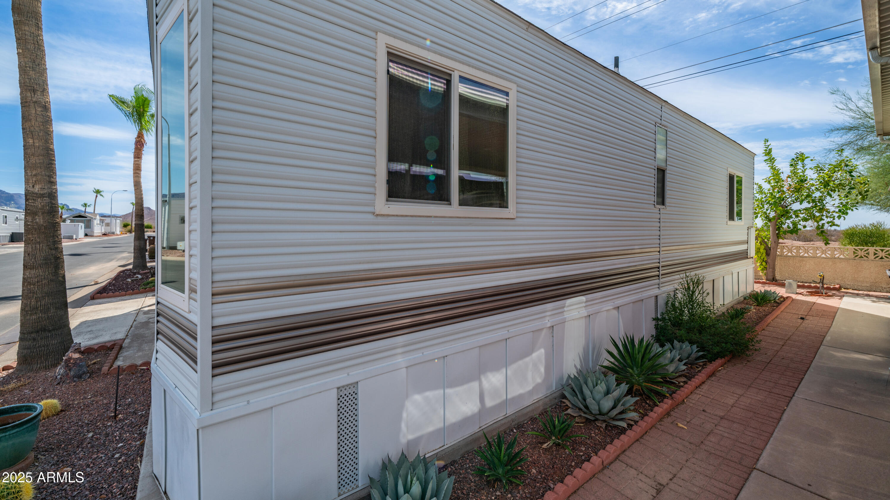 3 Ore Cart Drive, Unit 3 Apache Junction, AZ 85119 - Photo 30 of 59 a backyard of a house with plants and outdoor seating