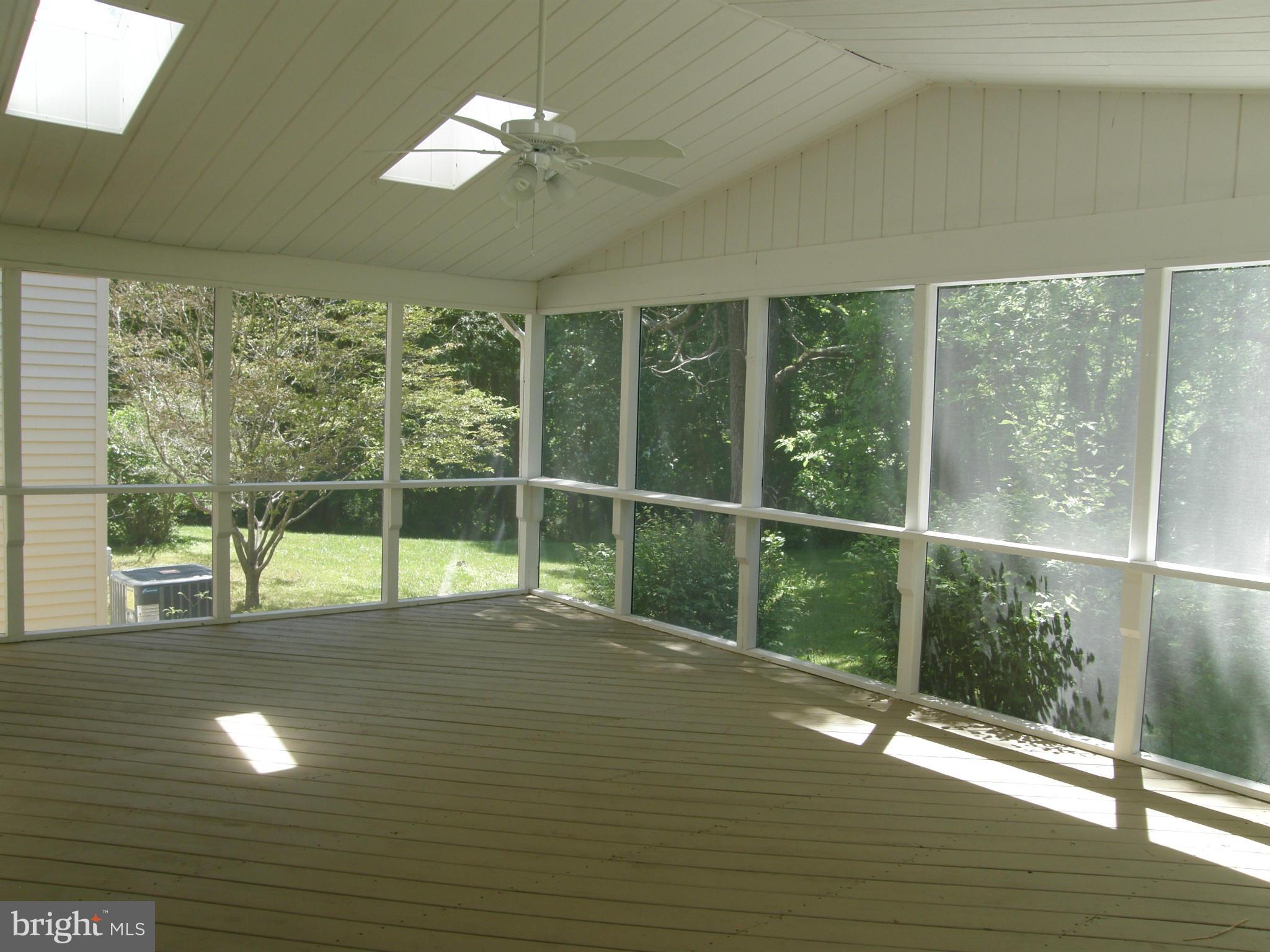 5603 Sweet Air Road Baldwin, MD 21013 - Photo 13 of 30 a view of empty room with wooden floor and fan
