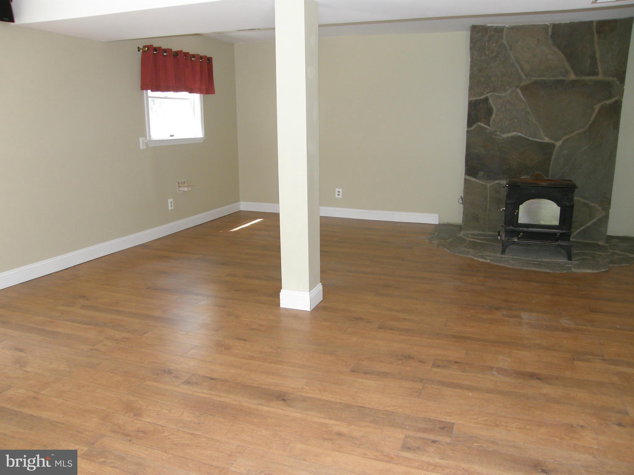 5603 Sweet Air Road Baldwin, MD 21013 - Photo 16 of 30 an empty room with wooden floor and windows