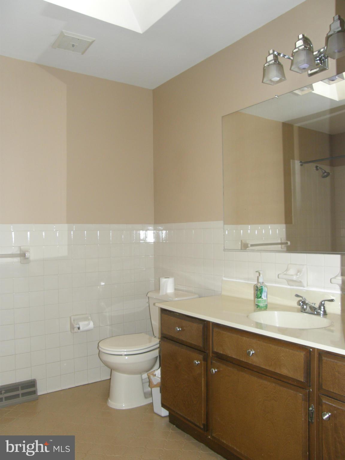 5603 Sweet Air Road Baldwin, MD 21013 - Photo 17 of 30 a bathroom with a sink a toilet and mirror