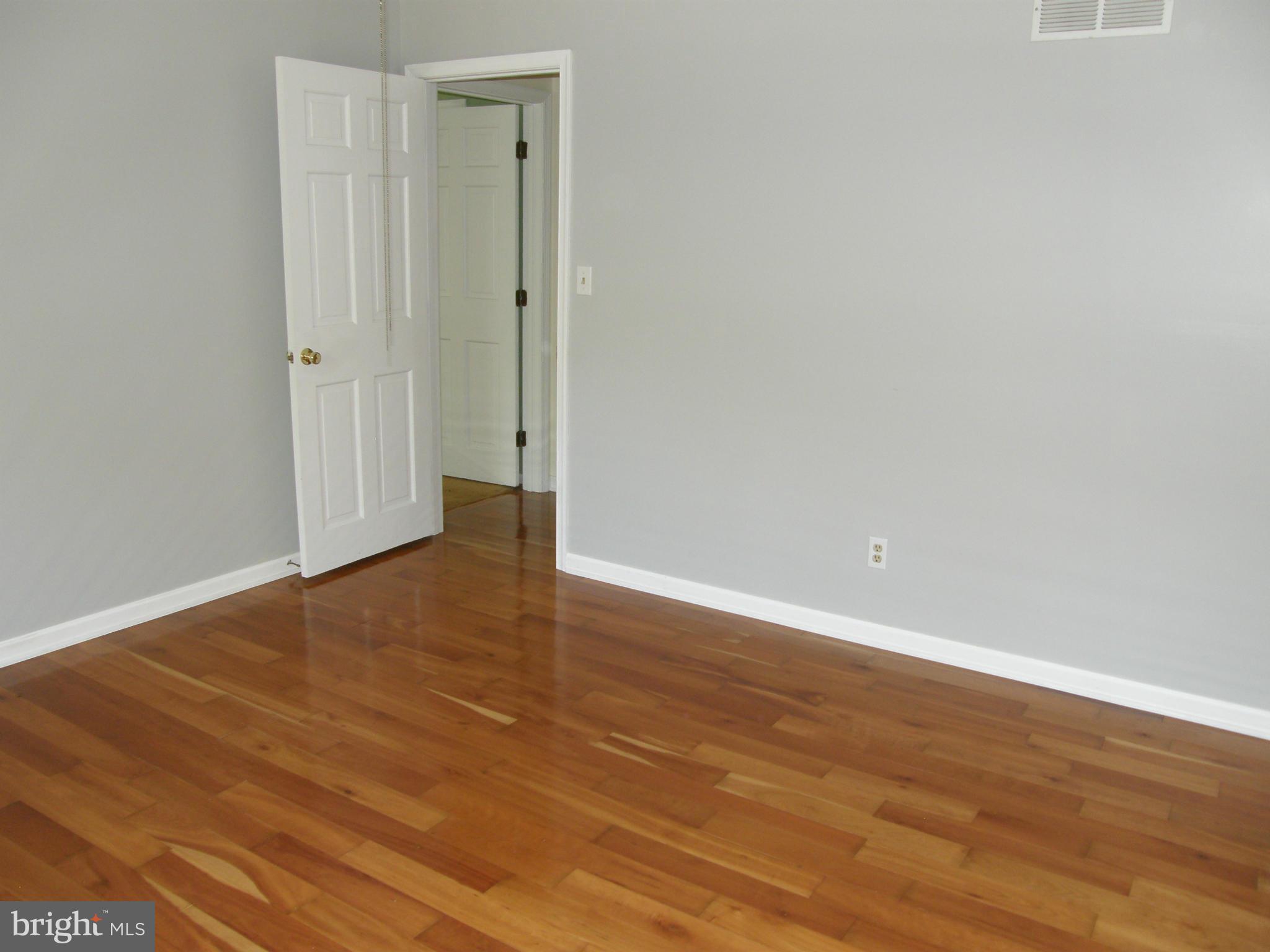 5603 Sweet Air Road Baldwin, MD 21013 - Photo 23 of 30 a view of an empty room with wooden floor
