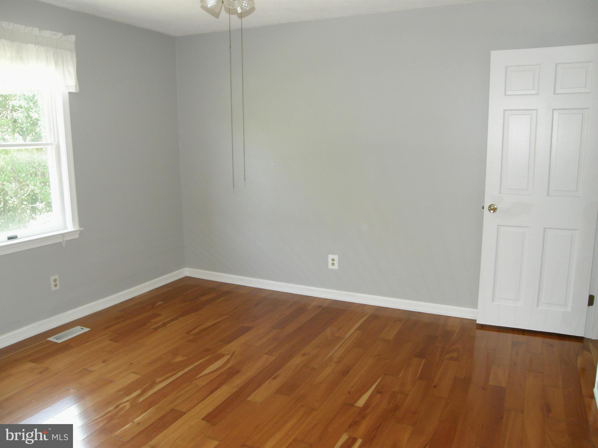5603 Sweet Air Road Baldwin, MD 21013 - Photo 24 of 30 an empty room with wooden floor and windows