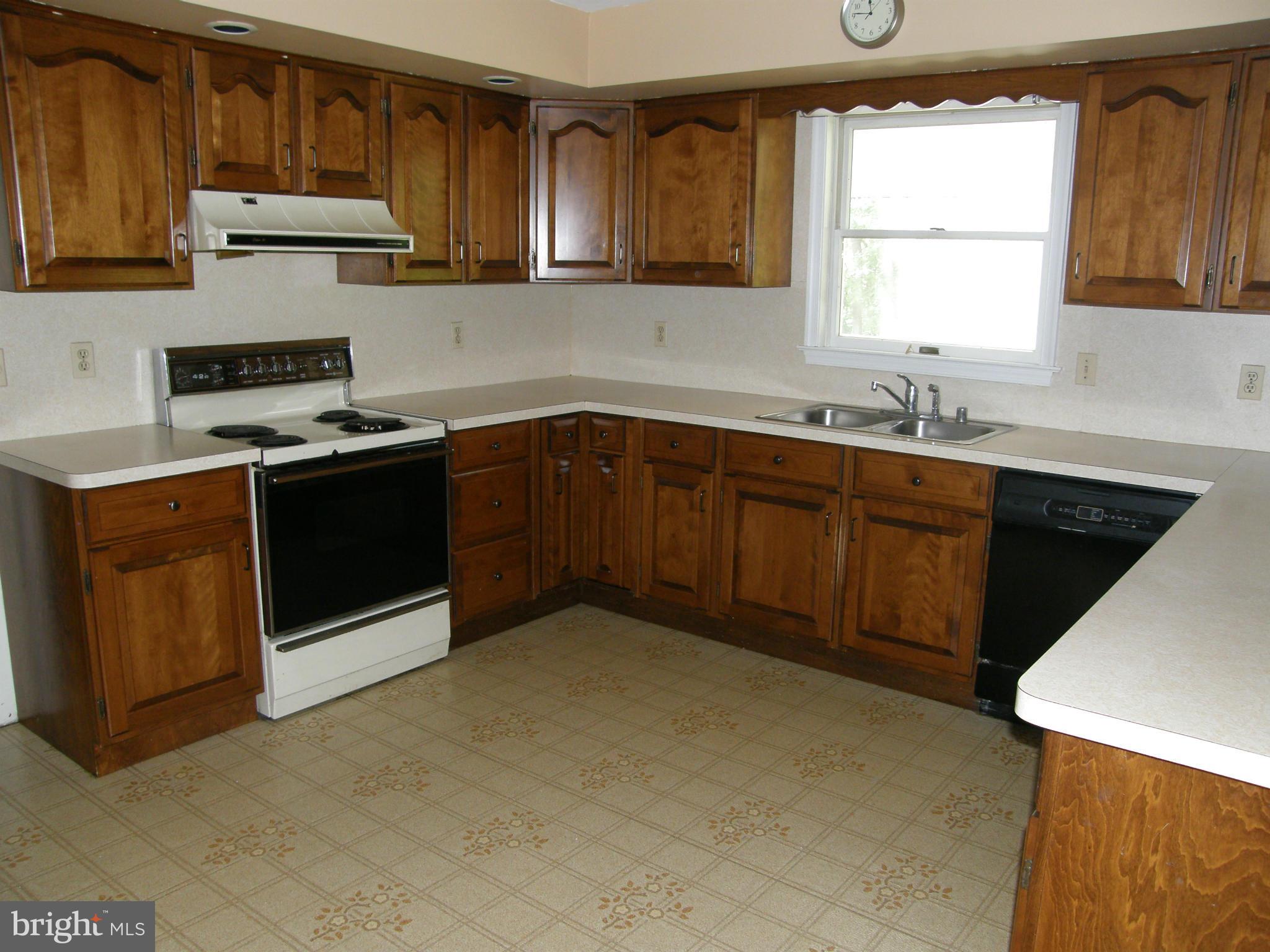 5603 Sweet Air Road Baldwin, MD 21013 - Photo 6 of 30 a kitchen with stainless steel appliances granite countertop a sink stove and refrigerator