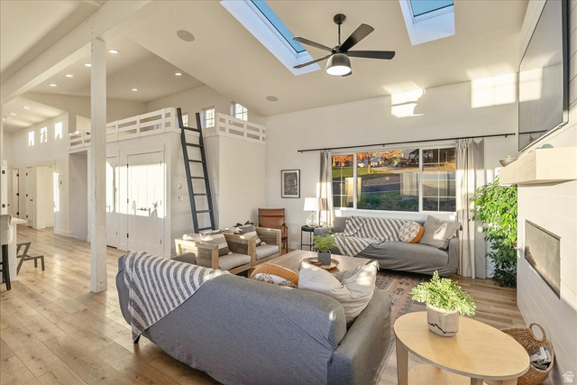 1800 Spring Oaks Drive Springville, UT 84663 - Photo 23 of 68 Living room featuring a high ceiling, hardwood / wood-style floors, ceiling fan, recessed lighting, and a skylight