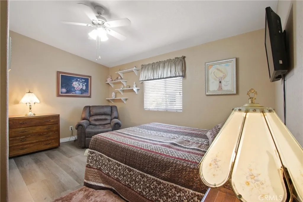 4095 Fruit La, Unit 743 La Verne, CA 91750 - Photo 12 of 21 a bedroom with a bed and a flat screen tv