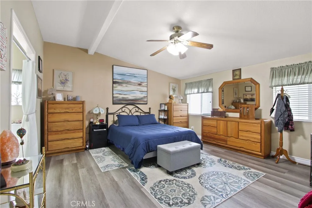 4095 Fruit La, Unit 743 La Verne, CA 91750 - Photo 15 of 21 a bedroom with a bed and wooden floor