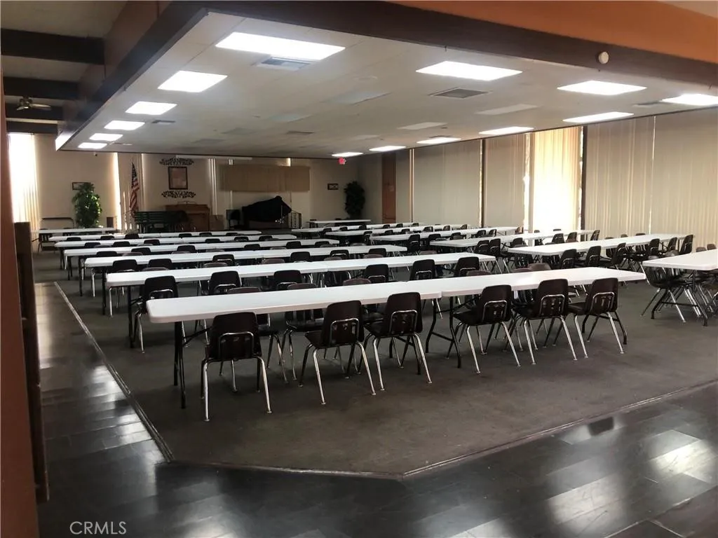 4095 Fruit La, Unit 743 La Verne, CA 91750 - Photo 20 of 21 a view of a a dining room with furniture a rug and wooden floor