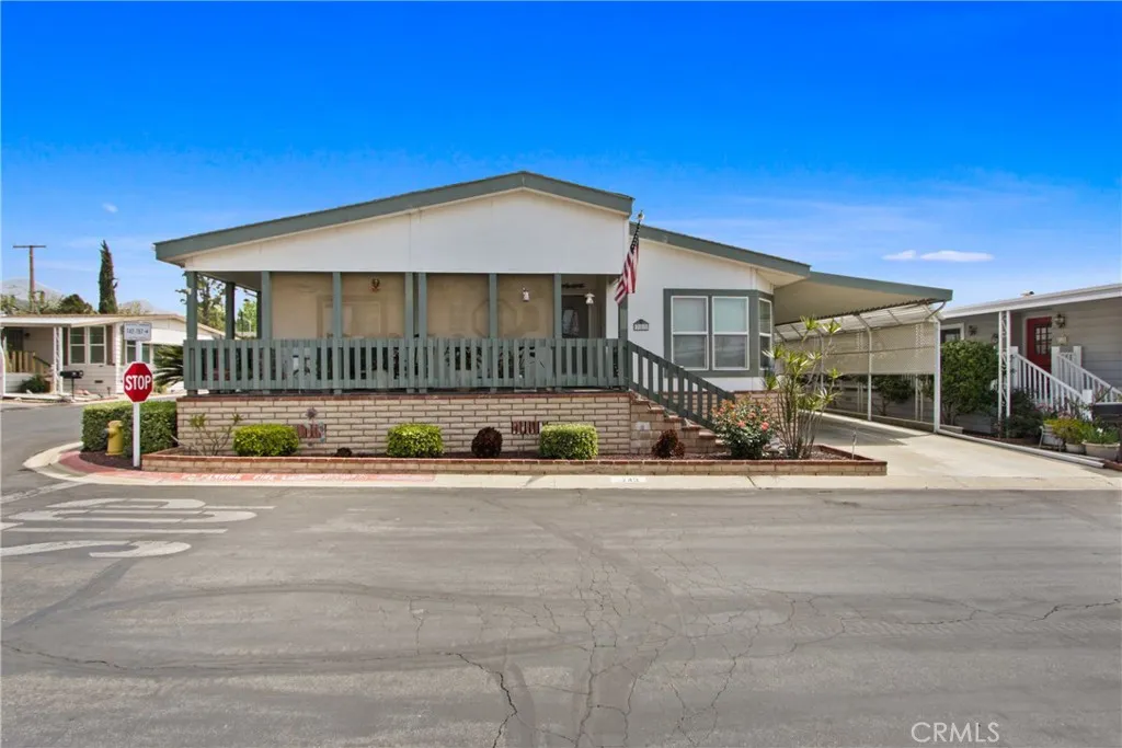 4095 Fruit La, Unit 743 La Verne, CA 91750 - Photo 2 of 21 a view of a house with a patio and a yard