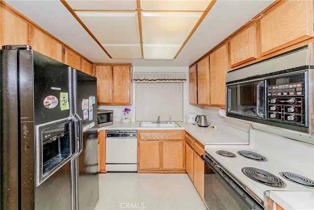 a bedroom with furniture and a chandelier