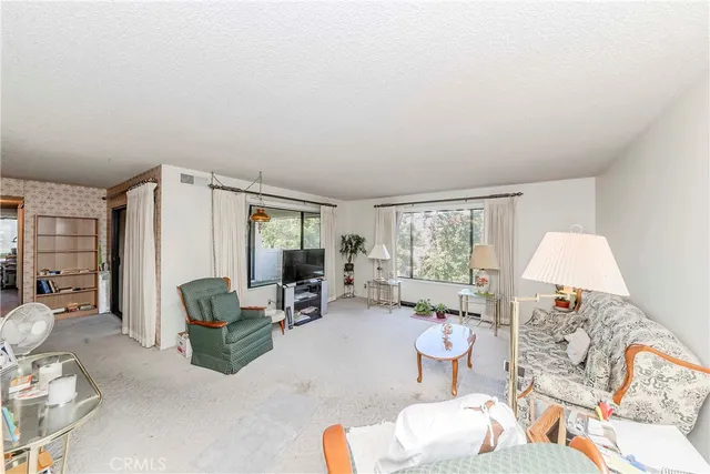 a bathroom with a sink vanity mirror and toilet