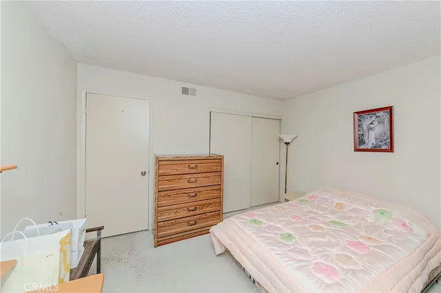 a view of a bedroom with furniture and staircase