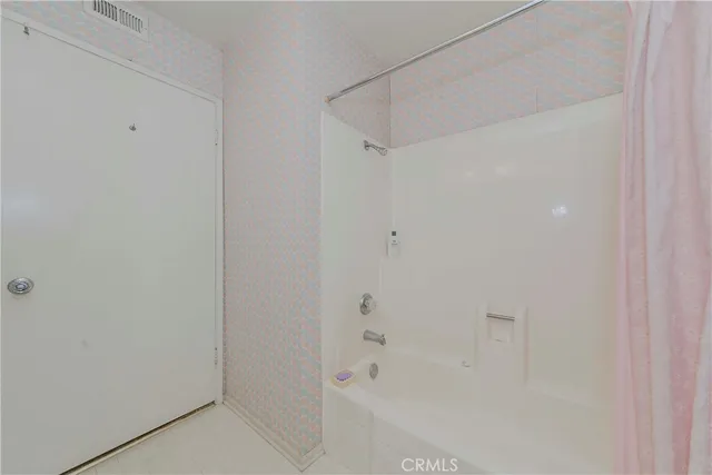 a bedroom with a bed and a table