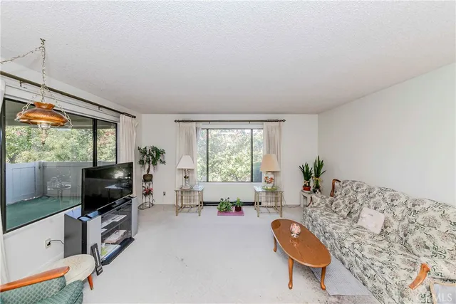 a bedroom with a bed and a table