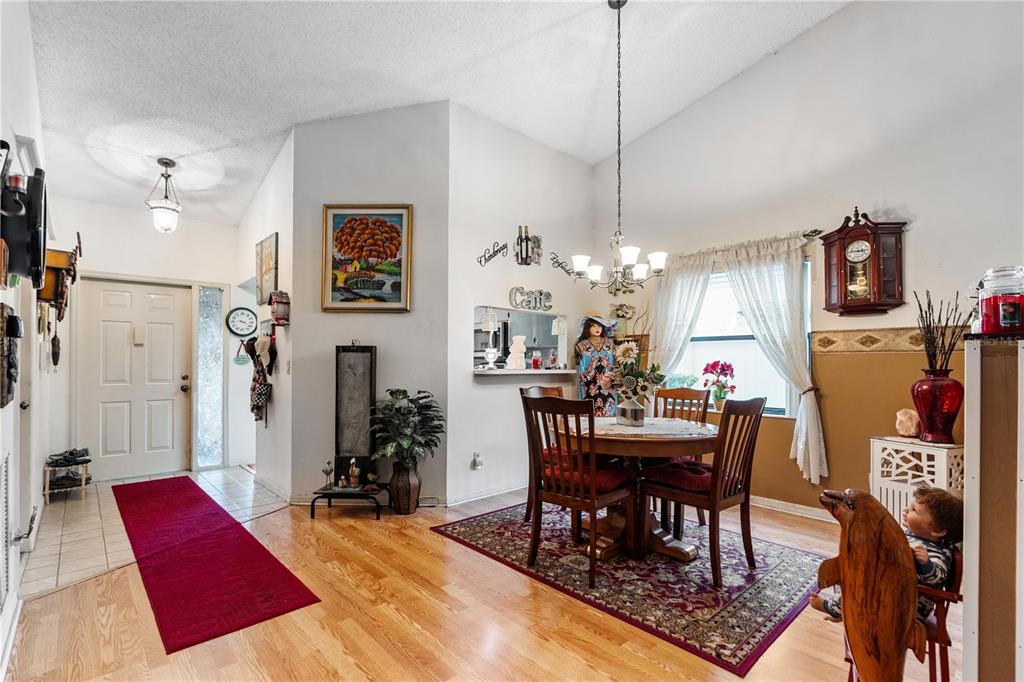 11719 Rose Tree Drive New Port Richey, FL 34654 - Photo 11 of 51 a view of a dining room with furniture