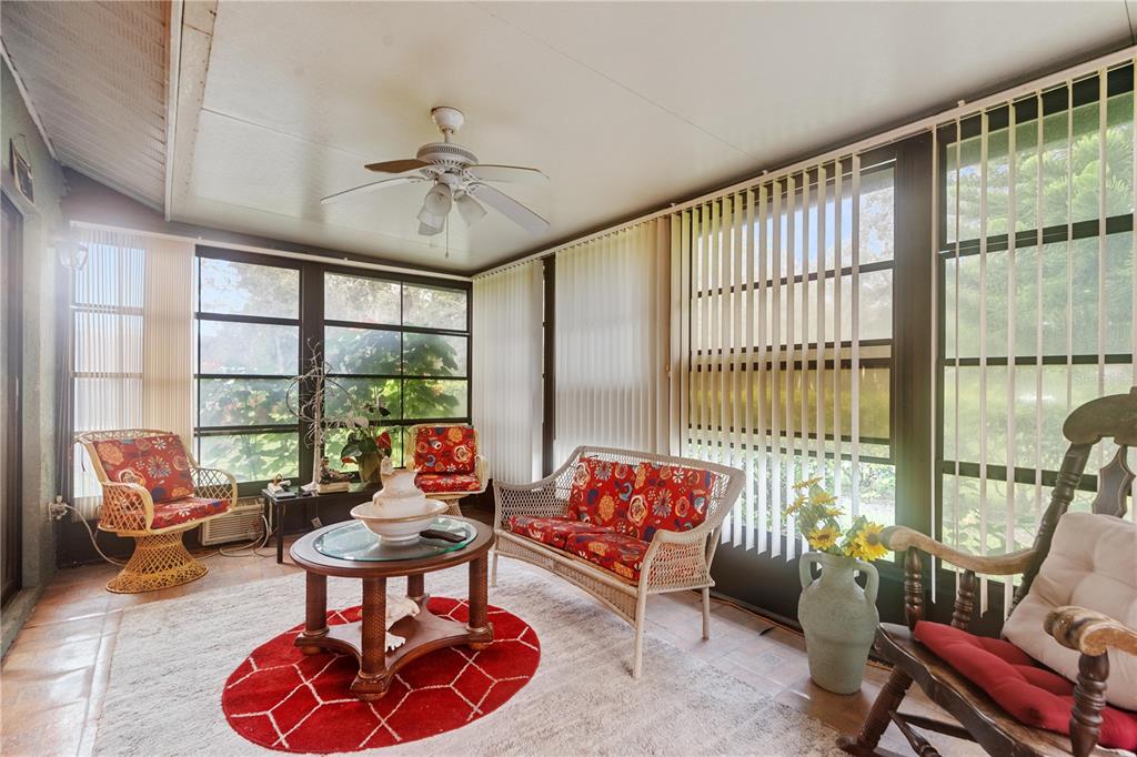 11719 Rose Tree Drive New Port Richey, FL 34654 - Photo 29 of 51 a living room with furniture and a potted plant