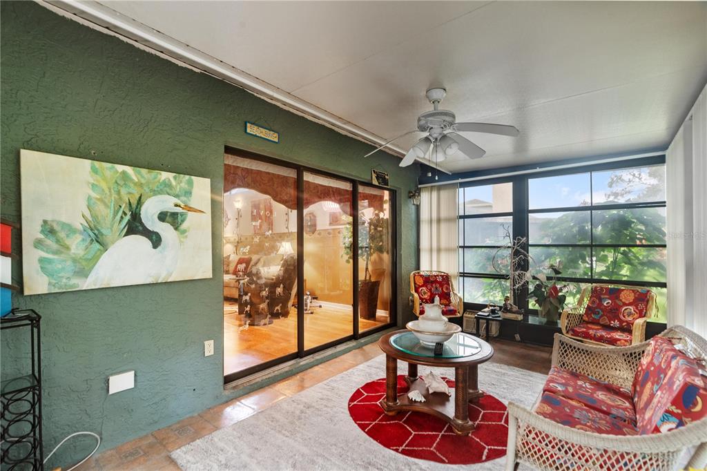 11719 Rose Tree Drive New Port Richey, FL 34654 - Photo 30 of 51 a living room with furniture and a large window