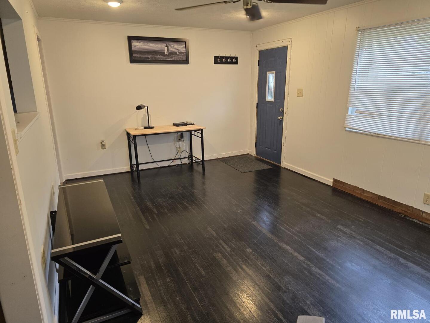 505 South 2nd Street Marion, IL 62959 - Photo 3 of 21 a view of an empty room with wooden floor and a window