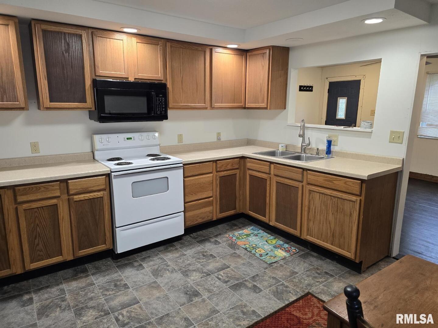 505 South 2nd Street Marion, IL 62959 - Photo 6 of 21 a kitchen with a sink stove and microwave