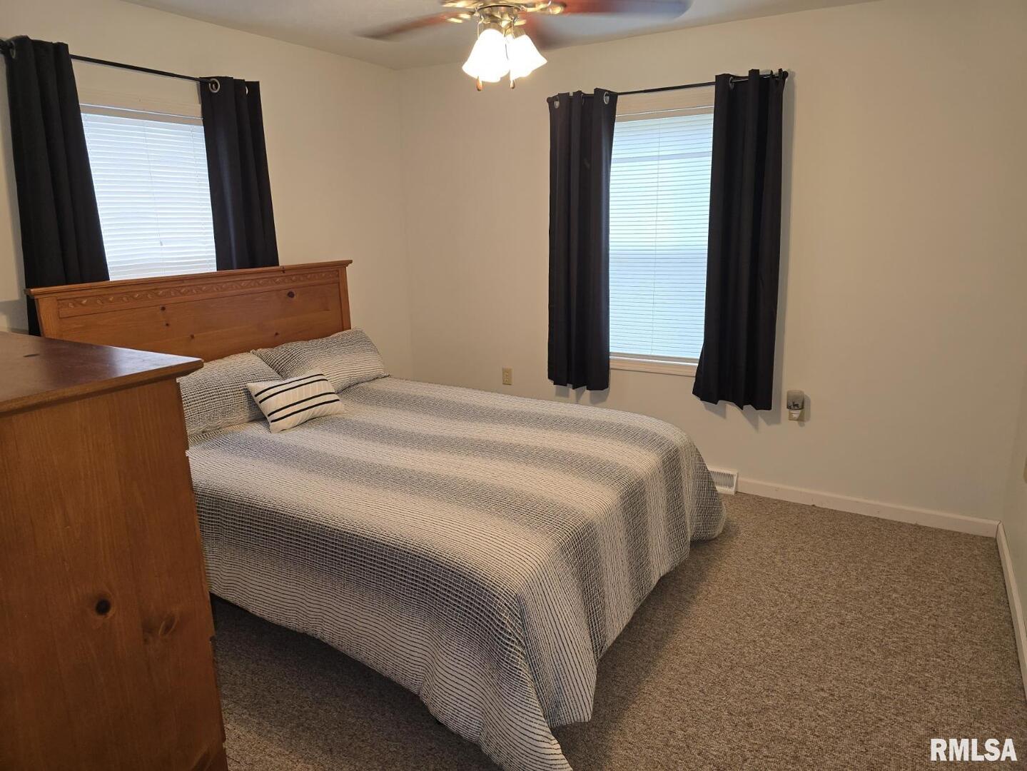 505 South 2nd Street Marion, IL 62959 - Photo 9 of 21 a bedroom with a bed and a mirror