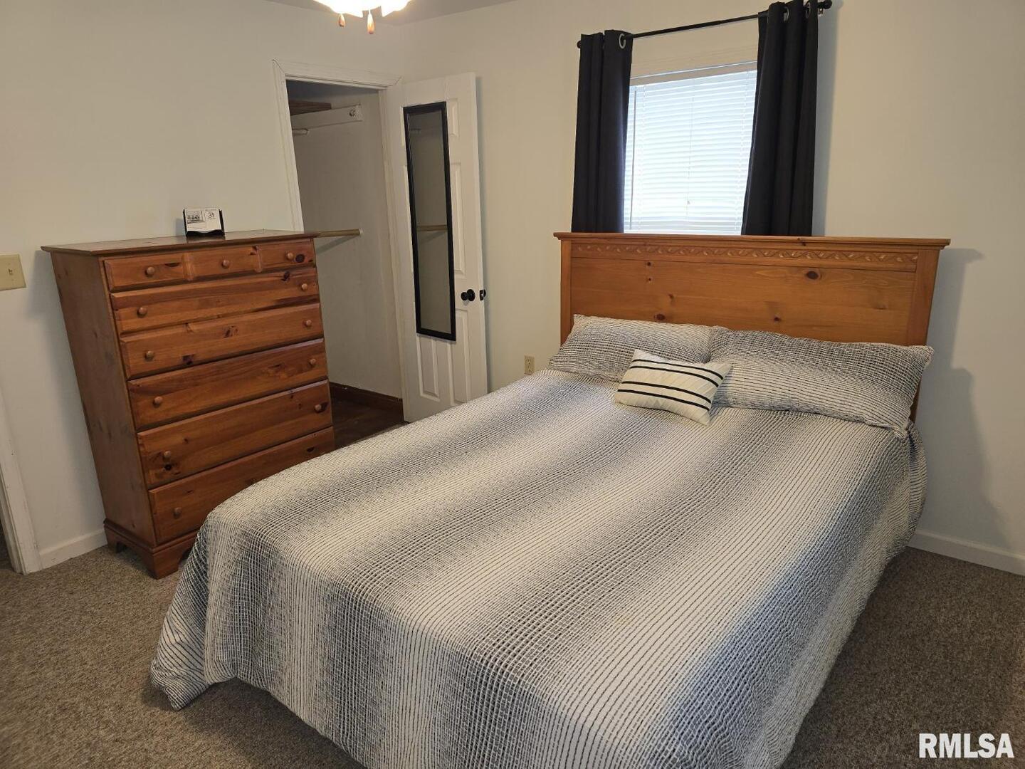 505 South 2nd Street Marion, IL 62959 - Photo 10 of 21 a bedroom with a bed and a mirror