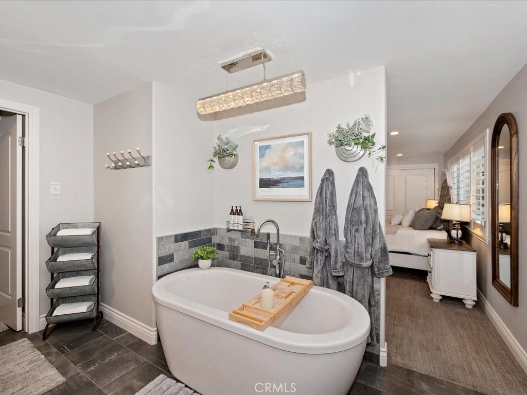 27550 North Bay Road Lake Arrowhead, CA 92352 - Photo 16 of 32 a white bath tub sitting next to a white toilet