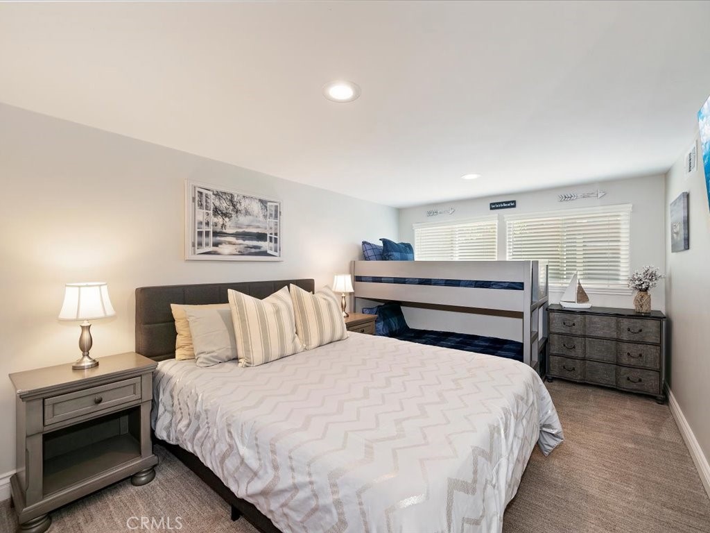 27550 North Bay Road Lake Arrowhead, CA 92352 - Photo 19 of 32 a bedroom with a bed and a lamp
