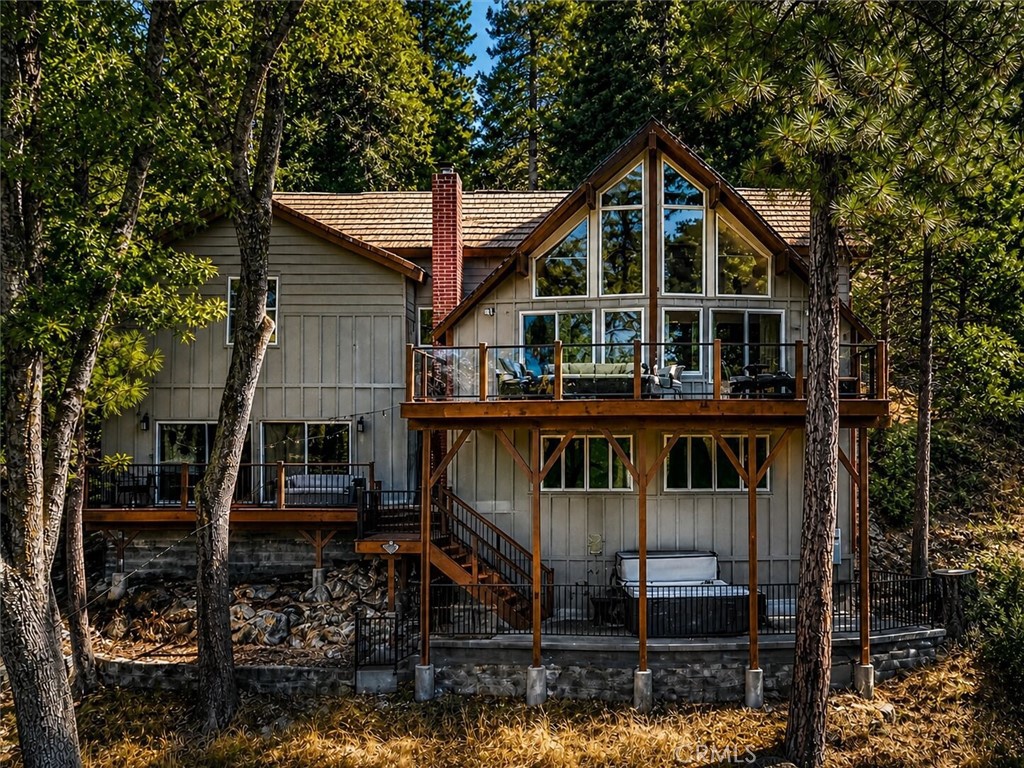27550 North Bay Road Lake Arrowhead, CA 92352 - Photo 28 of 32 a front view of a house with balcony