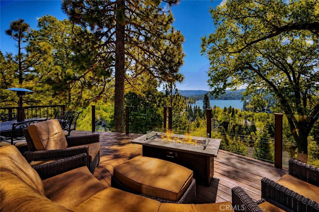 27550 North Bay Road Lake Arrowhead, CA 92352 - Photo 5 of 32 a view of a patio with couches and a fire pit