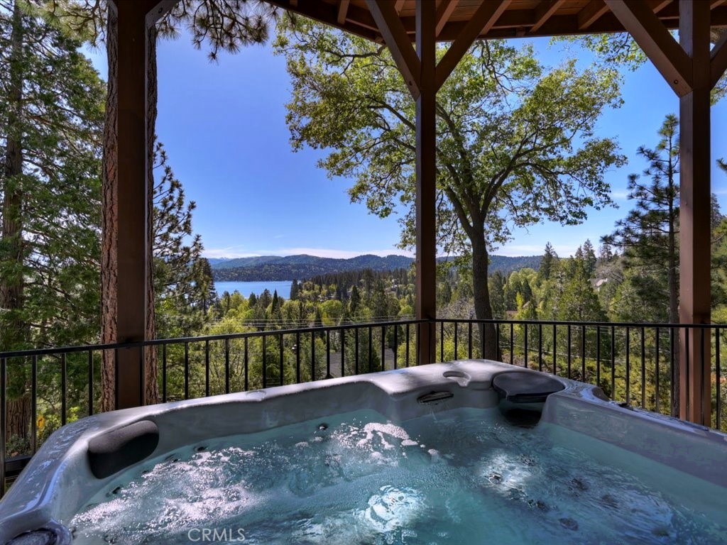 27550 North Bay Road Lake Arrowhead, CA 92352 - Photo 6 of 32 a view of a couches with a tree in a yard