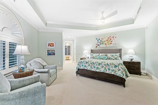 a bedroom with a bed couch and window