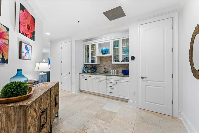 a kitchen with stainless steel appliances kitchen island granite countertop a refrigerator and a stove