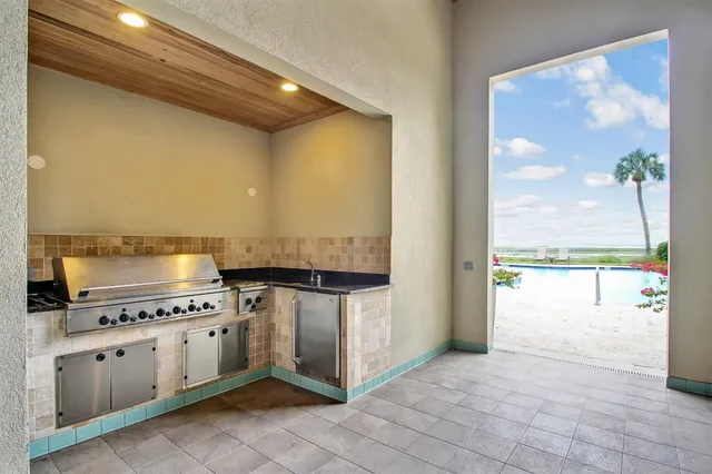 a kitchen with stainless steel appliances granite countertop a stove and a refrigerator