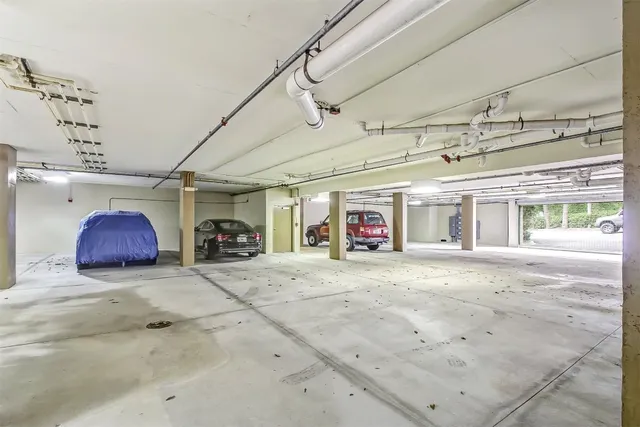 a big room with projector and a chandelier
