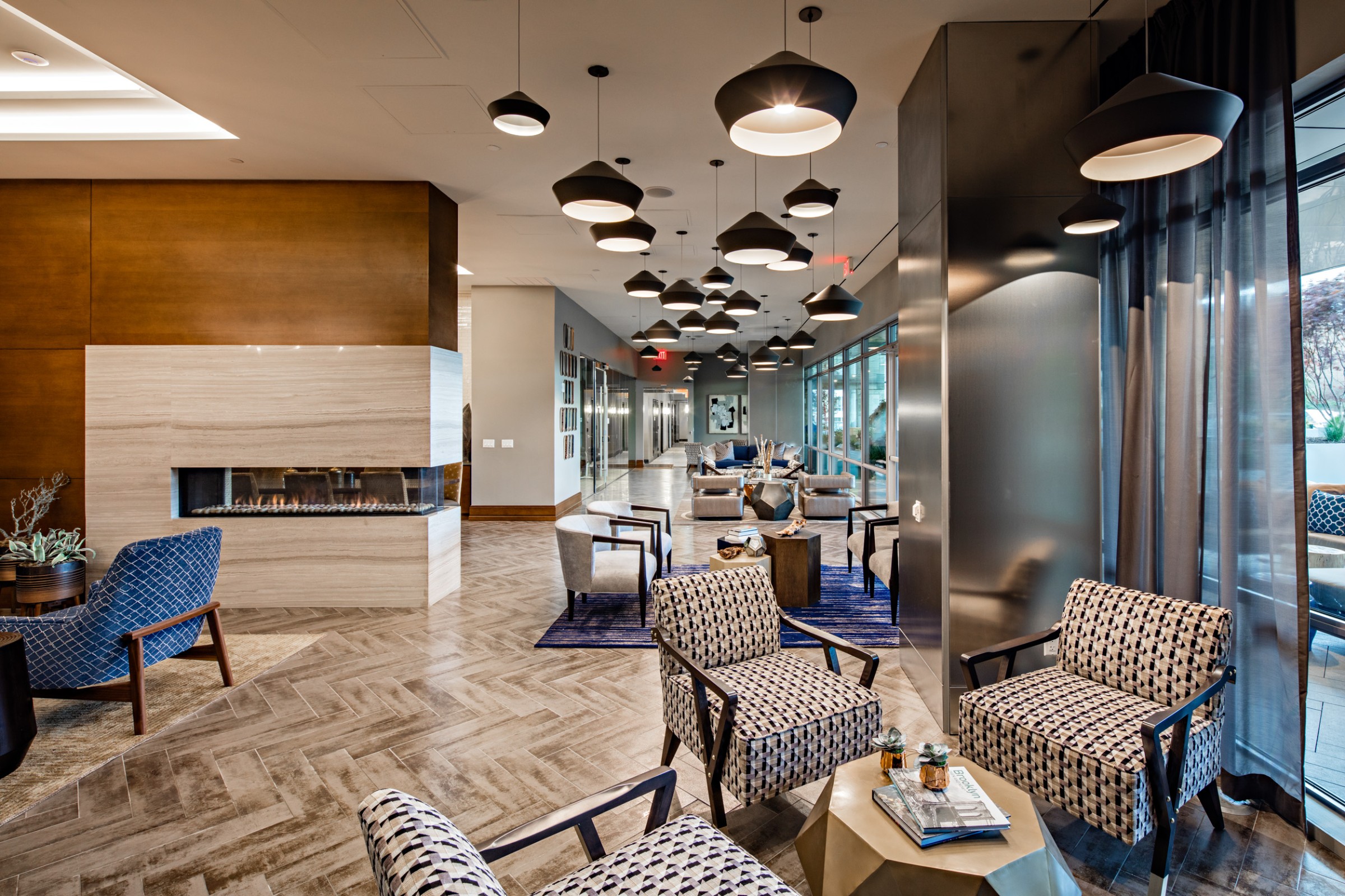 1524 Sheepshead Bay Road, Unit 6D Brooklyn, NY 11235 - Photo 15 of 25 a living room with furniture potted plant and a fireplace