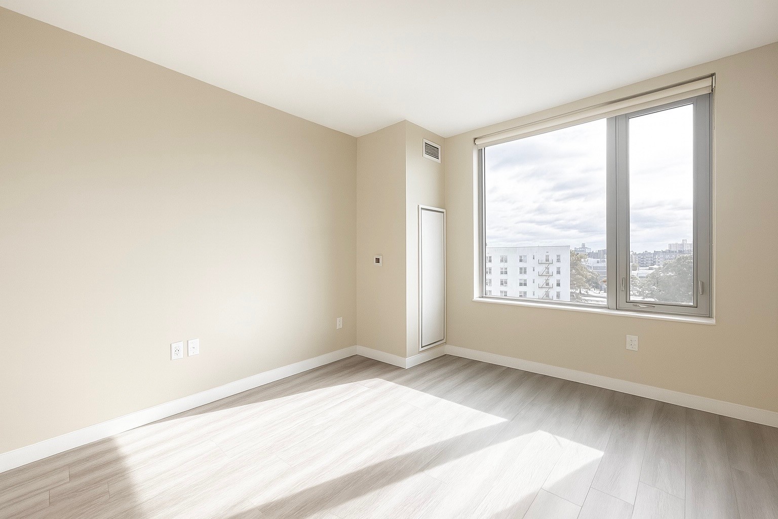 1524 Sheepshead Bay Road, Unit 6D Brooklyn, NY 11235 - Photo 3 of 25 a view of an empty room with a window