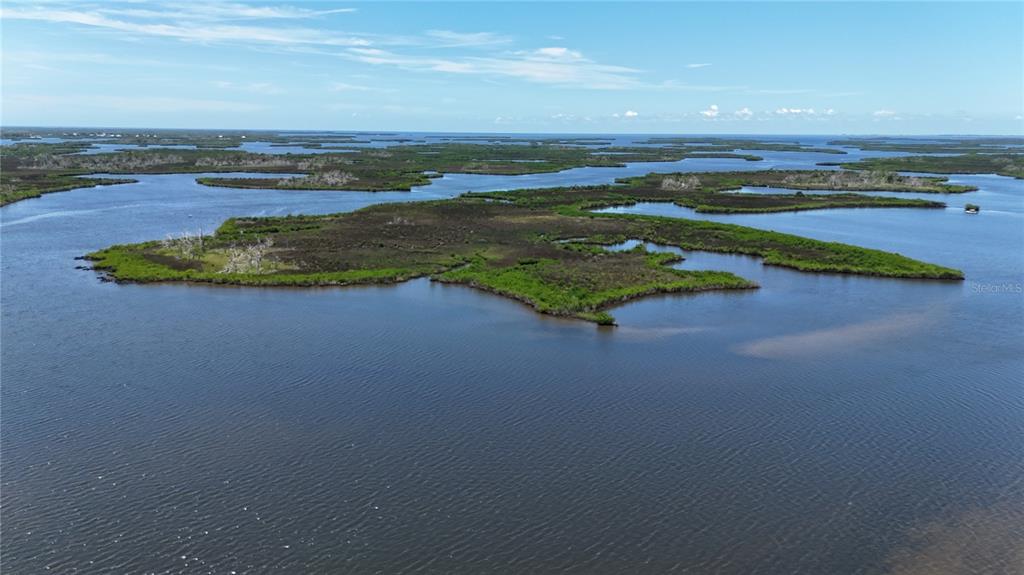 a view of a lake with a big yard