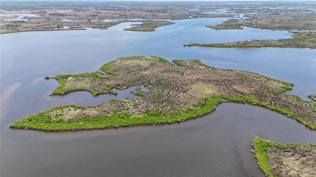 12301 The Salt Crystal River Crystal River, FL 34429 - Photo 21 of 36 a view of a lake with a mountain