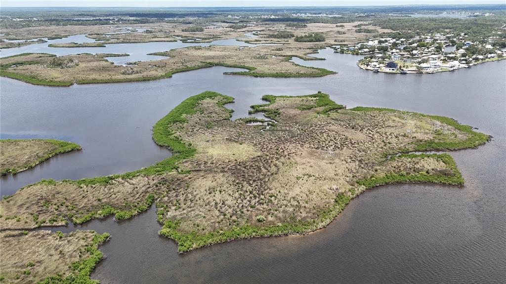12301 The Salt Crystal River Crystal River, FL 34429 - Photo 25 of 36 an aerial view of a house with a lake view