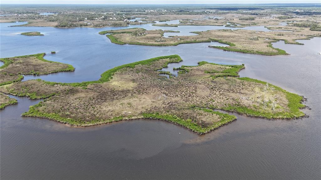 12301 The Salt Crystal River Crystal River, FL 34429 - Photo 27 of 36 an aerial view of beach and lake