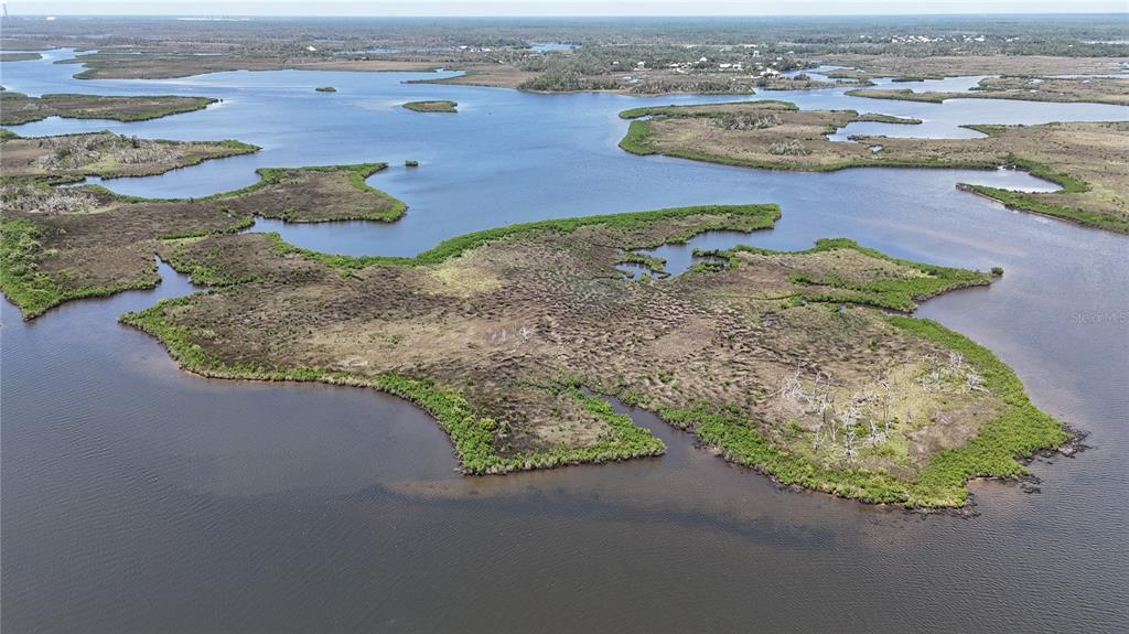 12301 The Salt Crystal River Crystal River, FL 34429 - Photo 29 of 36 an aerial view of a house with a yard