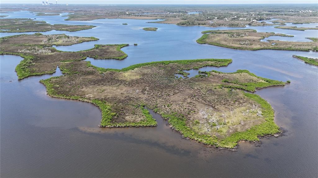 12301 The Salt Crystal River Crystal River, FL 34429 - Photo 30 of 36 an aerial view of a house with a yard