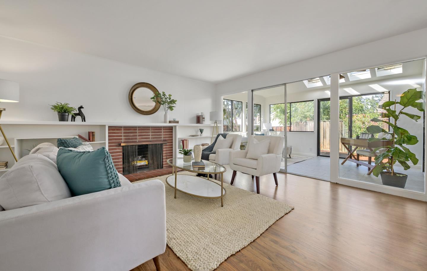 64 Paul Avenue Mountain View, CA 94041 - Photo 1 of 24 a living room with furniture a fireplace and a large window